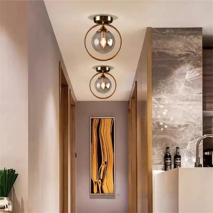 Plafonnier Design Anneau Doré & Boule Verre