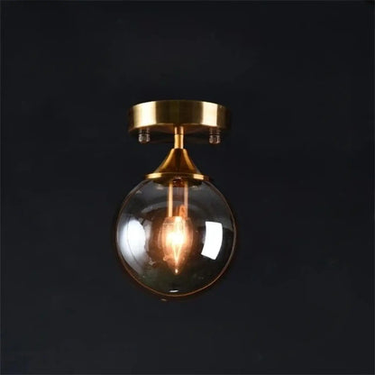 Plafonnier Design Anneau Doré & Boule Verre